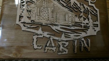Welcome to our cabin wooden sign, with mountains in back ground